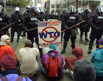 Protesters block police line from moving forward in a downtown Seattle intersection November 30, 1999. Reuters Photos<br/> 