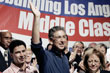 Phil Angelides, center, waves during a speech before the Los Angeles County Federation of Labor AFL-CIO, Sept. 4, 2006.