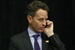 Timothy Geithner talks on his cell phone during President Obama's news conference at the conclusion of the G-20 in Pittsburgh.