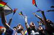Lauren Hendricks, 20, of Tallahassee, Fla., left, and Cameron Tolle, 21, of Cincinnati, Oh., chant with thousands of gay rights