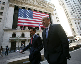 Lloyd Blankfein, right, CEO of Goldman Sachs, leaves the New York Stock Exchange after attending a panel discussion. AP Images</br> 