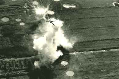A helicopter gunship pulls out of an attack in the Mekong Delta during Speedy Express, January 1969. AP/MCINERNEY 