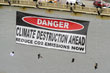 Protesters hang a sign from the West End Bridge before the start of the G-20 summit, Sept. 23, 2009 in Pittsburgh.