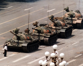 A Chinese protestor blocks a line of tanks heading east on Beijing's Cangan Blvd. June 5, 1989 in front of the Beijing Hotel. AP Images</br> 