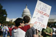 A couple participates in a gay rights demonstration in Washington, 10/11/2009.