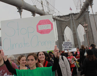Over 400 activists marched across the Brooklyn Bridge to push action on climate change.  