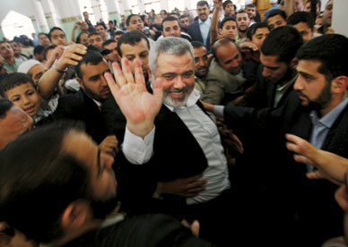 Hamas Prime Minister Ismail Haniya and his supporters in Gaza, May 1 HATEM MOUSSA/AP 