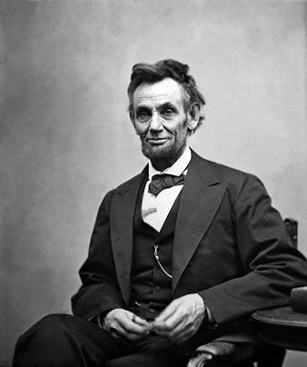 Abraham Lincoln (1809-1865) seated and holding his spectacles and a pencil on Feb. 5, 1865 in portrait by Alexander Gardner. Everett Collection 