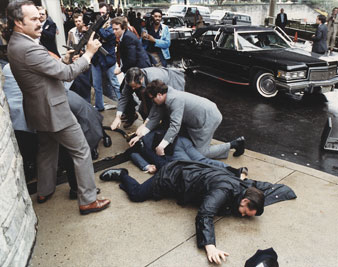 Seconds after the assassination attempt on President Reagan. James Brady lies (light blue suit) wounded, March 30, 1981. Everett Collection 