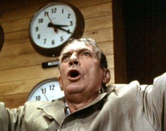 'I'm mad as hell and I'm not going to take it anymore.' Peter Finch in <i>Network</i>, 1976. Everett Collection 