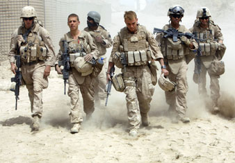 US Marines walk inside their base before patrolling near town of Khan Neshin in Rig district of Helmand province Reuters Photos<br/> 