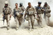 US Marines walk inside their base before patrolling near town of Khan Neshin in Rig district of Helmand province